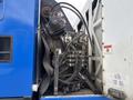 Close-up of hydraulic components and controls on the side of a 2013 International DuraStar 4300 truck