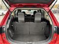 A 2016 Mitsubishi Outlander with the rear seats folded down, revealing a spacious cargo area with a flat floor and black interior upholstery