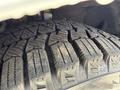 Close-up of a tire tread on a 2021 Ford Transit Connect showing distinct patterns designed for traction and stability