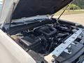 A 2017 Chevrolet Colorado with its hood open displaying the engine compartment including various components and hoses