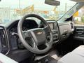 Interior view of a 2018 Chevrolet Silverado 1500 showing the steering wheel and dashboard with displays and controls