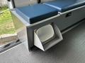 A 2020 Mercedes-Benz Sprinter 2500 interior featuring a storage compartment with a curved opening and a soft padded seat above it