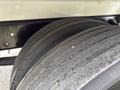 Close-up of a tire on a 2025 Peterbilt 536 showing the tread pattern and details of the rubber surface