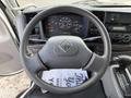 Steering wheel of a 2008 International CityStar with dashboard controls gauges visible and gear shift below