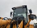 A 2016 Hyundai HL940 heavy loader with a large bucket and prominent cabin features, including side mirrors and front lights