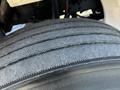 Close-up of a truck tire tread showing detailed grooves and patterns on a 2011 Freightliner M2 106 tire