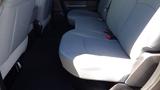 Interior view of the rear seats of a 2014 RAM 3500 with gray upholstery and seating for three passengers