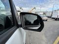 A side mirror of a 2019 Mercedes-Benz Metris showing a reflection and part of the vehicle's door