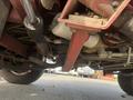 Undercarriage view of a 2013 Toro Grounds Master 5910 showing various mechanical components and the chassis construction