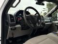 Interior view of a 2021 Ford F600 showing the dashboard steering wheel and controls