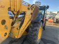 A 2013 JCB 510-56 Loadall featuring a yellow telescopic arm and black cabin with large tires in the foreground