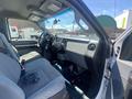 Interior of a 2016 Ford F-350 SD showing front seats dashboard and steering wheel