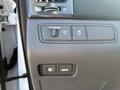 Close-up of the control panel featuring buttons for trunk release, fuel door release, and various vehicle settings in a 2015 Hyundai Sonata