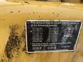 A yellow metal plate with multiple patent numbers and text detailing possible coverage for the Vermeer Corporation BC1000XL machine