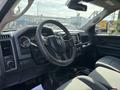 Interior view of a 2013 RAM 5500 showing the steering wheel dashboard and front seats with a focus on the controls and instruments