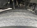 Close-up of a worn tire from a 2018 Ford F-750 showing visible tread patterns and surface wear