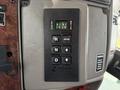 A close-up of the control panel in a 2008 Kenworth T370 featuring an Allison transmission control with buttons for selecting drive modes and monitoring