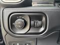 Control panel from a 2021 RAM 1500 featuring buttons for headlights fog lights and other vehicle settings