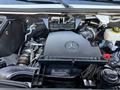 Close-up view of a 2023 Mercedes-Benz Sprinter 2500 engine showing the engine cover and components with the Mercedes-Benz logo prominently displayed