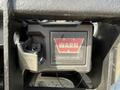 A WARN contactor control unit mounted on a Ford F-550 vehicle with electrical connectors visible on the side