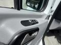Close-up of the door control panel in a 2016 Mercedes-Benz Sprinter featuring buttons for window and mirror adjustments