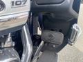 Close-up of the footboard and controls of a 2017 Harley-Davidson FLHTKL showing the Harley-Davidson logo and chrome accents