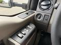Close-up of the interior controls of a 2008 Ford F-550 including window switches and climate control knobs