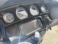 Close-up of the dashboard of a 2017 Harley-Davidson FLHTKL showing speedometer tachometer fuel gauge and a digital display panel