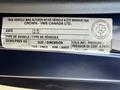 A label on a 2011 Ford Econoline providing vehicle information including VIN and specifications