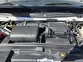 Close-up of the engine compartment of a 2021 Ford Econoline showing the air intake and various engine components