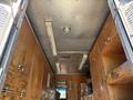 Interior view of a 2009 Morgan Olson Workhorse W62 with wooden lockers metal ceiling lights and fixtures
