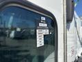2020 Peterbilt 330 with visible certification and approval stickers on the driver's side window