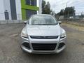 A 2014 Ford Escape with a silver exterior and distinctive front grille is parked facing forward