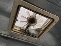 A ceiling vent fan with a circular design featuring multiple blades and control knobs, mounted in a square frame