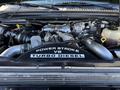 2008 Ford F-550 engine compartment featuring a Power Stroke V8 Turbo Diesel engine with various components and hoses visible