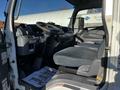 Interior view of a 2014 Mitsubishi Fuso FE showing the driver's seat dashboard and controls