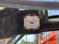 A close-up view of a Sandvik gauge displaying numerical readings mounted on a felt-covered surface inside a machine
