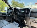 Interior of a 2018 Ford F-550 showing the driver's seat steering wheel dashboard and control panel