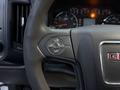 Close-up of the steering wheel of a 2017 GMC Sierra 3500HD showing control buttons for cruise settings with the GMC logo embossed on the wheel