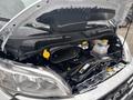 2023 RAM Promaster 3500 with the hood raised showing the engine compartment featuring various components and fluid reservoirs