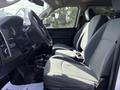 Interior of a 2013 RAM 5500 featuring two gray fabric front seats and a view of the steering wheel and dashboard