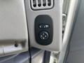Close-up of a control panel with two buttons featuring arrows for adjusting settings in a 2012 International DuraStar 4300 vehicle