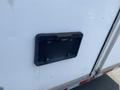 A black access panel designed for a 2008 Wells Industries Inc EW1422 trailer with a handle and mounting holes visible