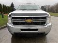 A 2013 Chevrolet Silverado 3500HD with a chrome grille and a prominent Chevrolet logo on the front