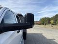 A 2013 RAM 5500 truck with a prominent side mirror showing a view of the vehicle from the left side