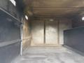 An empty cargo area of a 2021 Freightliner M2 106 with metal walls and no visible items or equipment inside