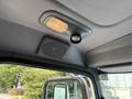 Interior view of a 2020 Peterbilt 330 truck showcasing the ceiling with a light fixture and speaker