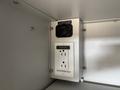 Electrical outlets and a power connection box mounted inside a compartment in a 2020 Mercedes-Benz Sprinter 2500