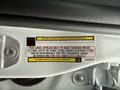 A label on the interior of a 2024 RAM 5500 providing incomplete vehicle tire and loading information and stating responsibility for accurate label information