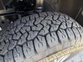 Close-up of a rugged tire tread pattern on a 2023 Mercedes-Benz Sprinter 2500 showcasing deep grooves and a sturdy design for enhanced traction and durability